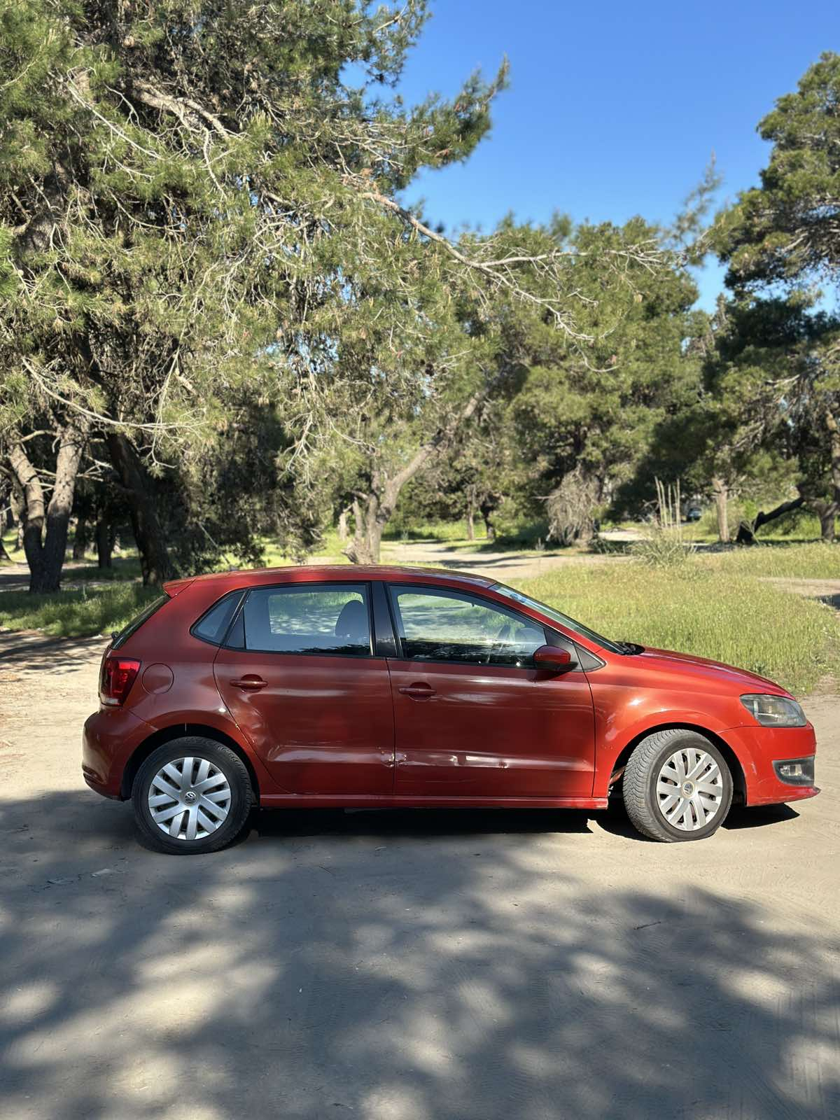 Car parked in front of a modern building during a sunny day in Ulcinj