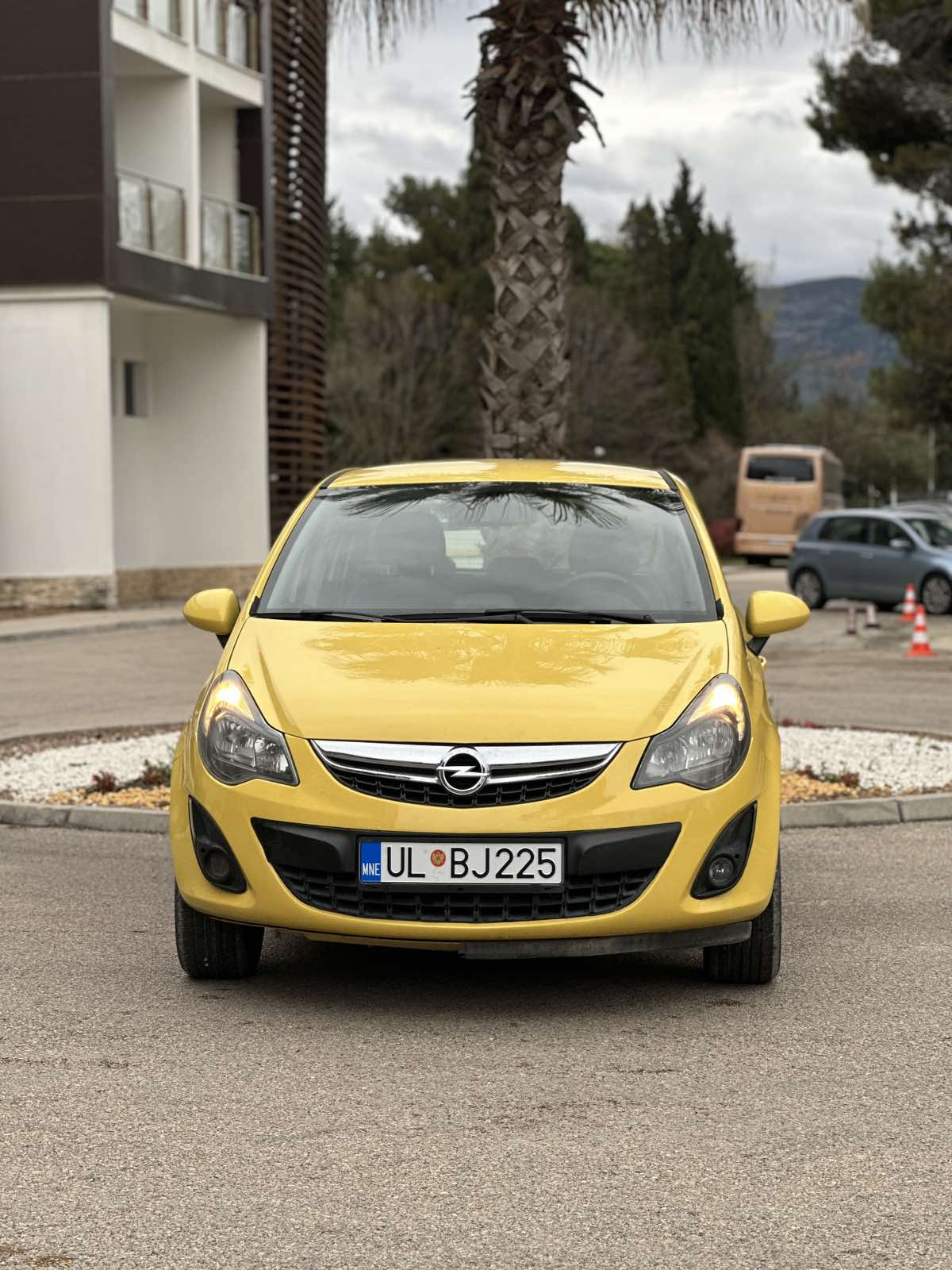 Car parked in front of a modern building during a sunny day in Ulcinj