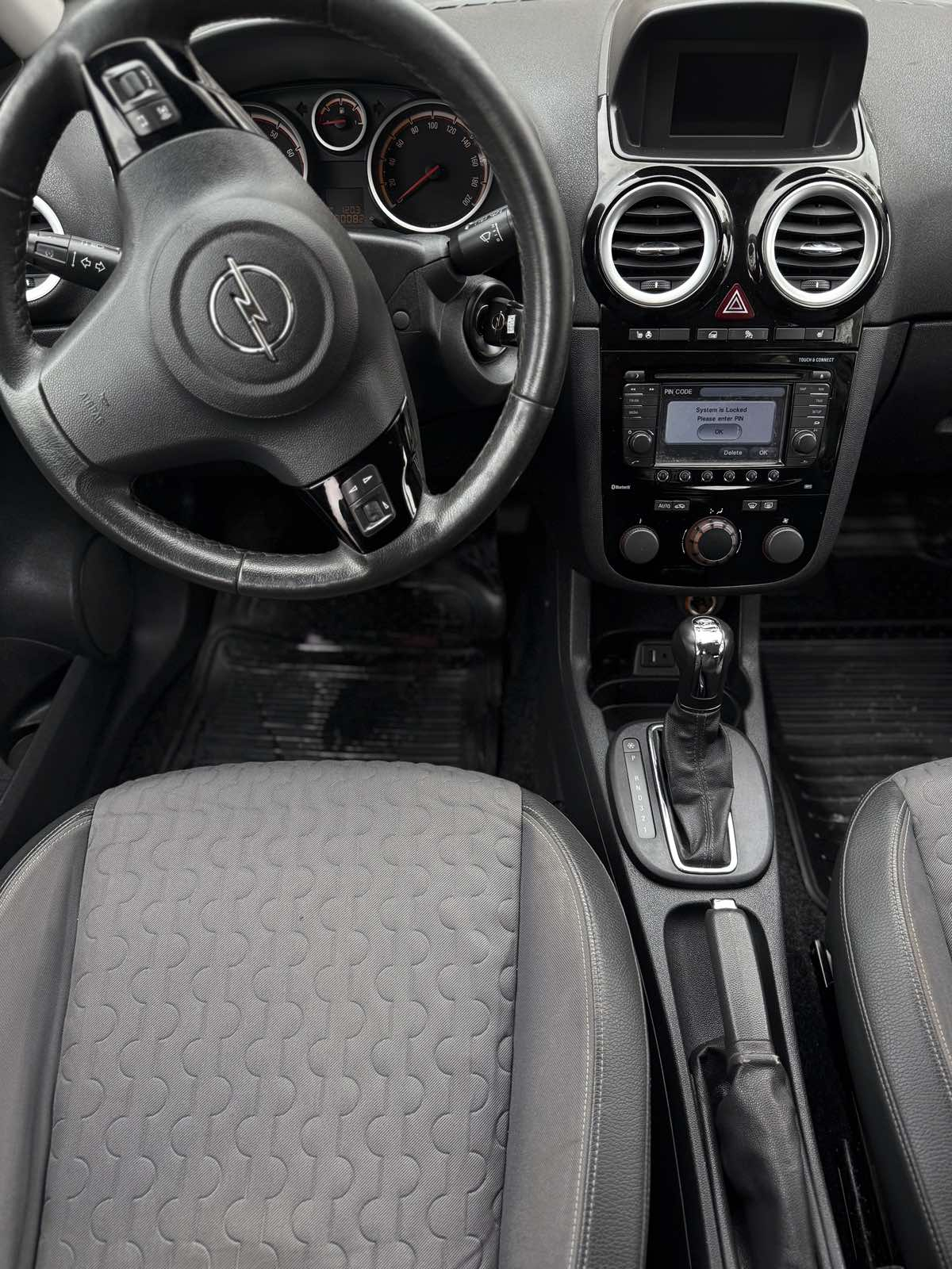 Car parked in front of a modern building during a sunny day in Ulcinj
