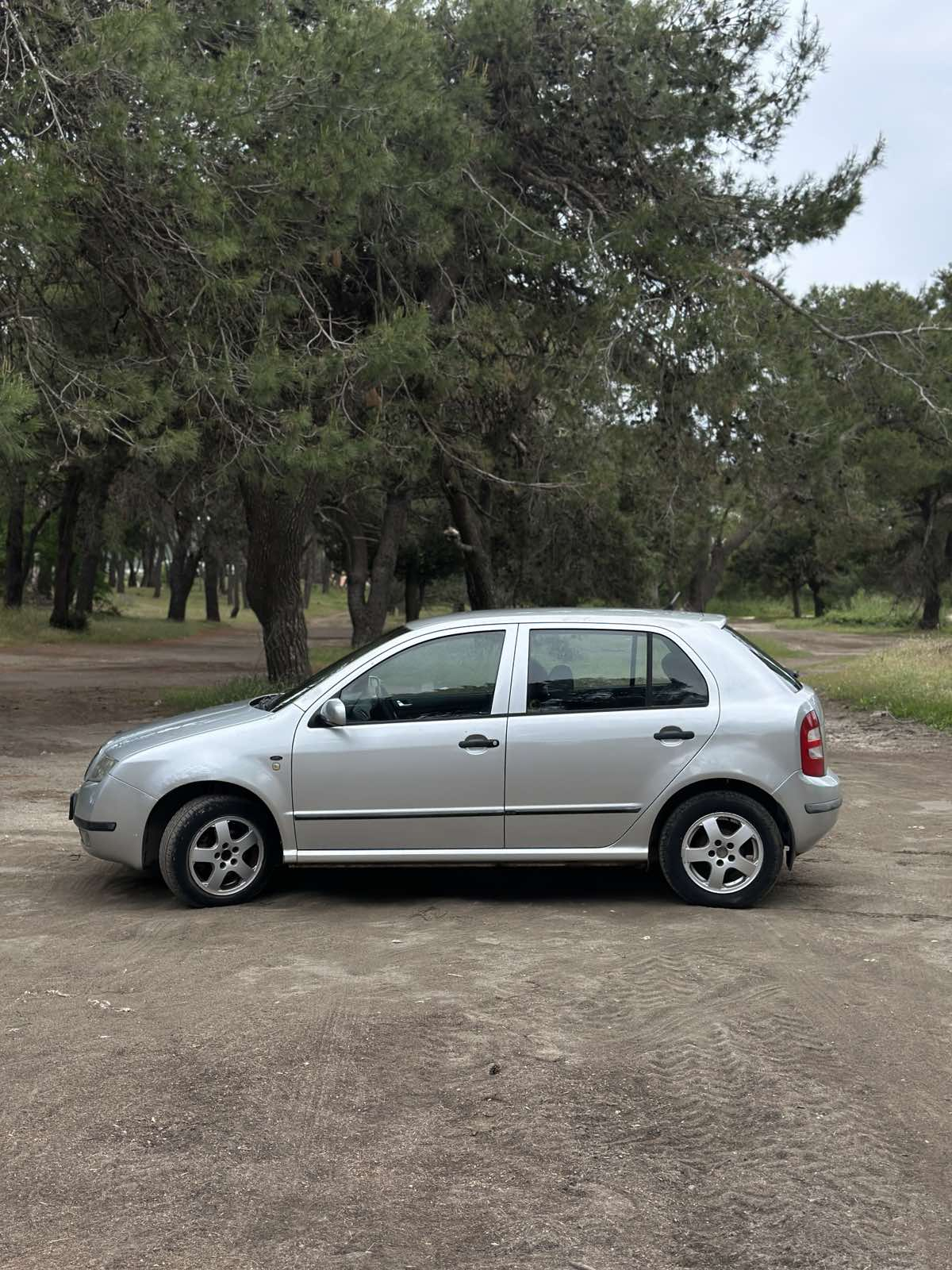 Car parked in front of a modern building during a sunny day in Ulcinj