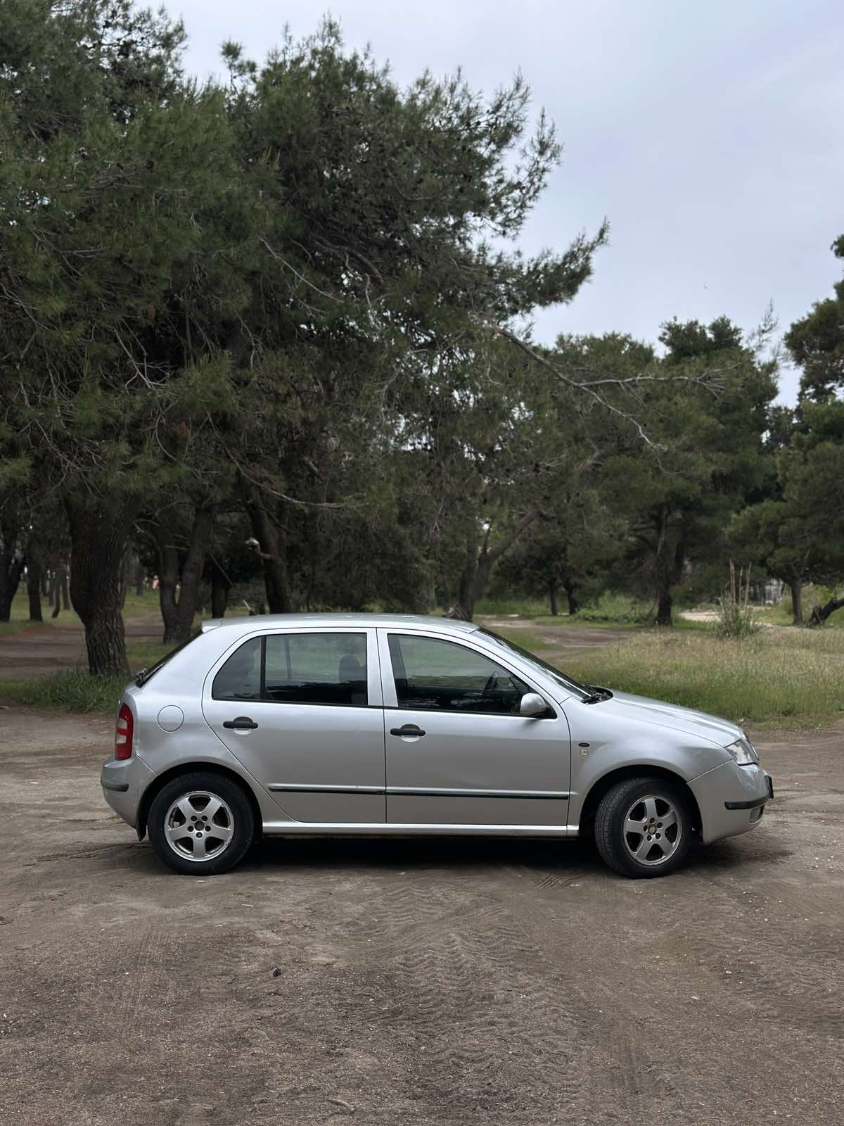 Car parked in front of a modern building during a sunny day in Ulcinj