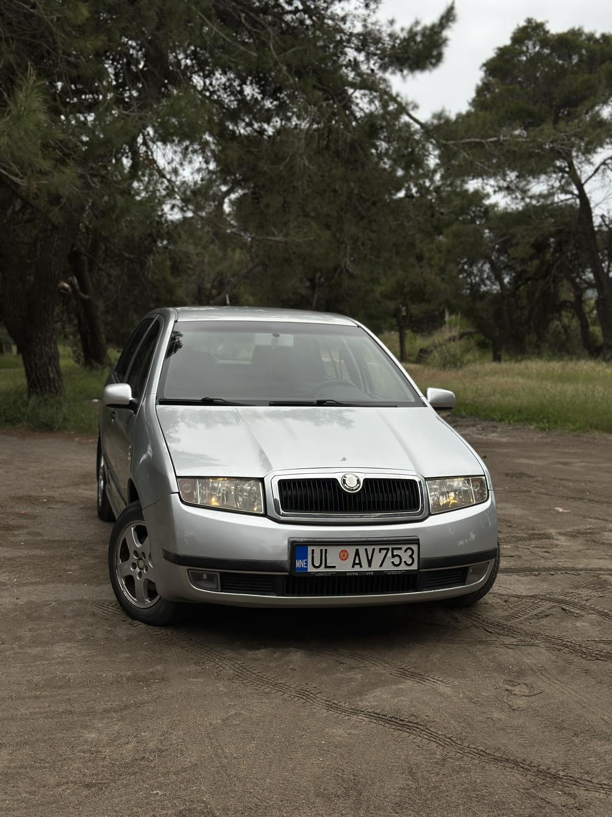 Car parked in front of a modern building during a sunny day in Ulcinj