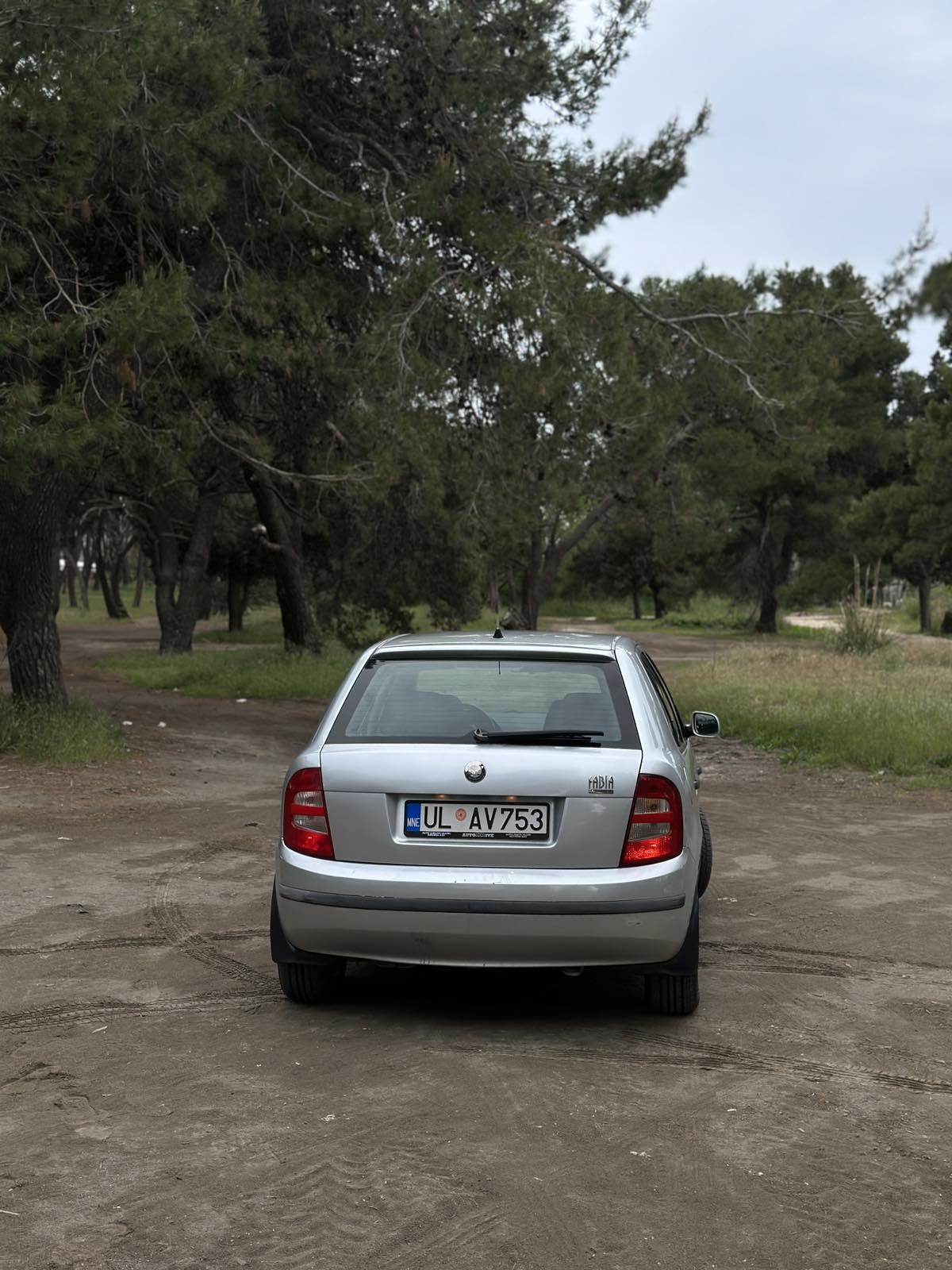 Car parked in front of a modern building during a sunny day in Ulcinj